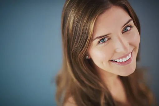 Woman with brown hair smiling